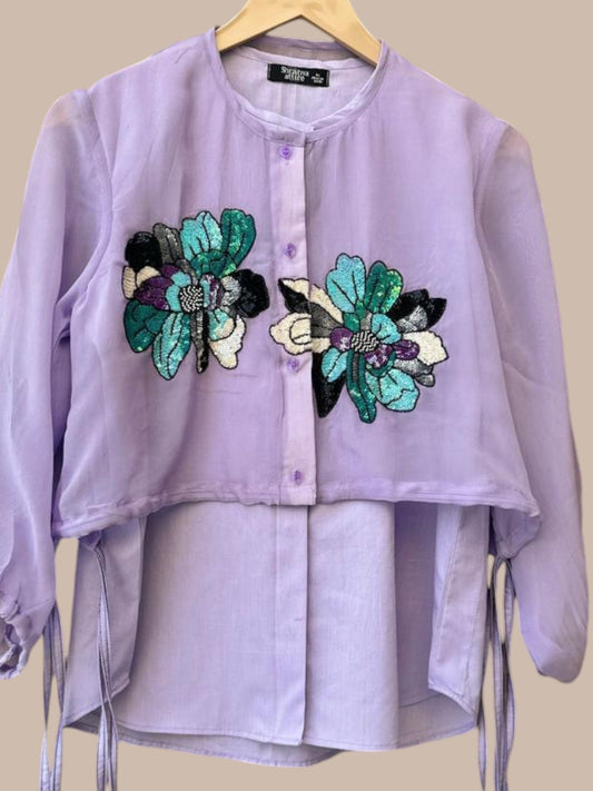 Mauve shirt, beautifully adorned with elegant embroidered motifs.